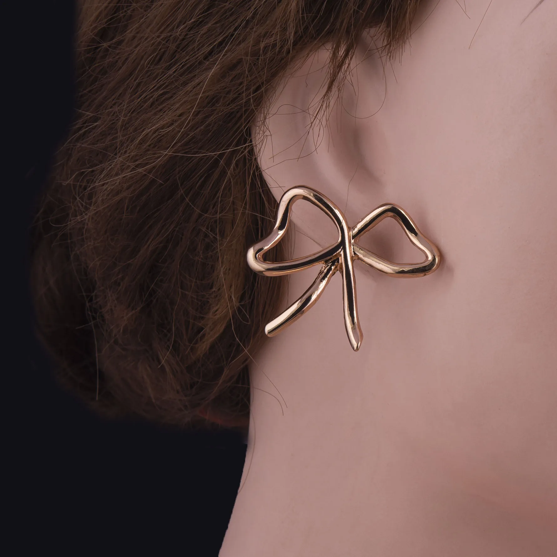 Gold Toned Bow Stud Tops Earrings